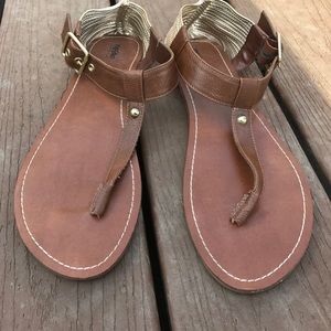 Brown and gold sandals.