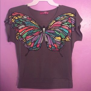 Cute t-shirt blouse with butterfly across chest.