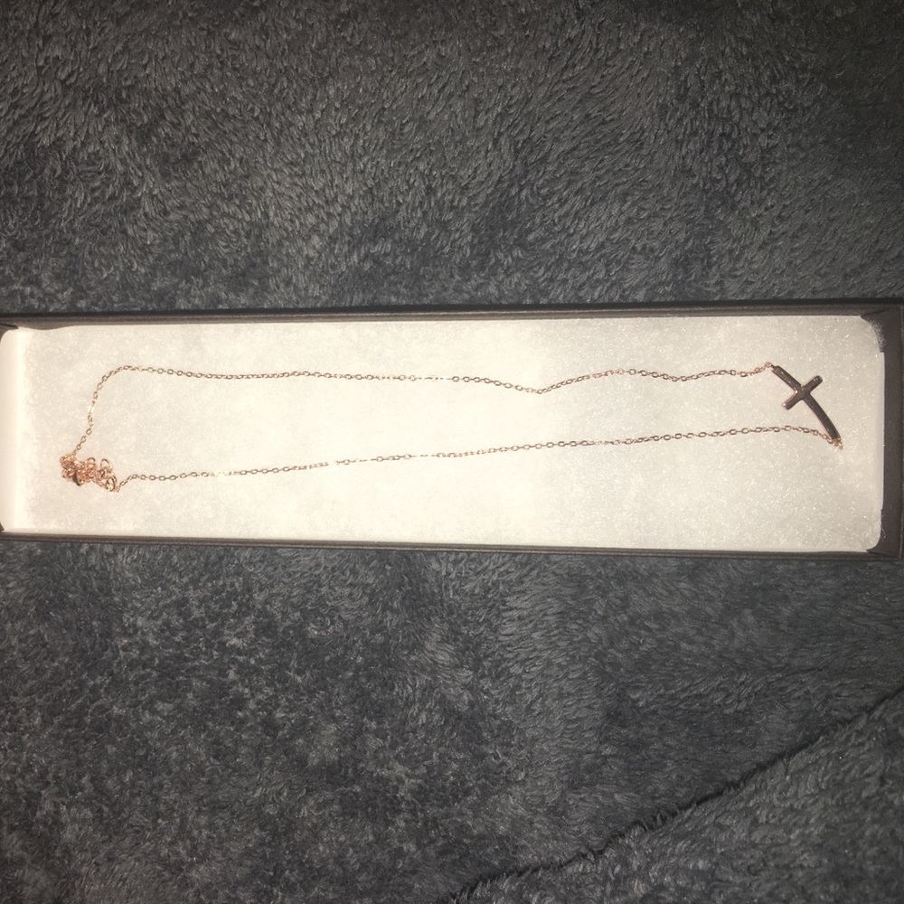 BRAND NEW! Never worn rose gold cross necklace.