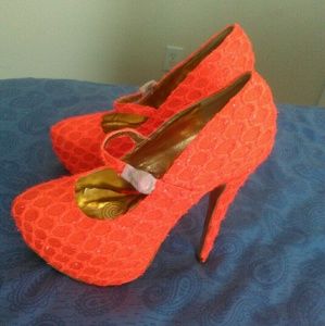 Neon orange pumps