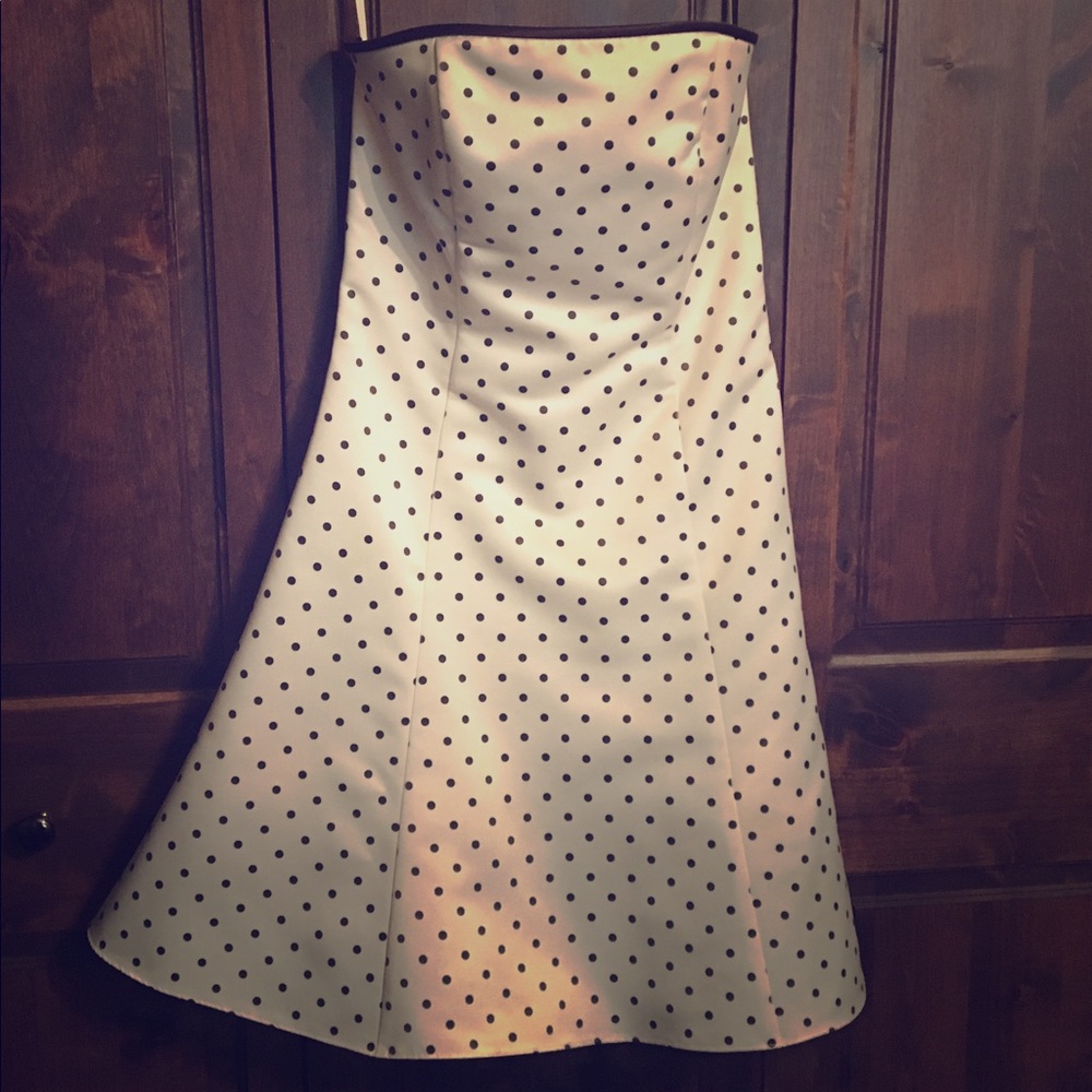 Simple white strapless dress with brown polka dot