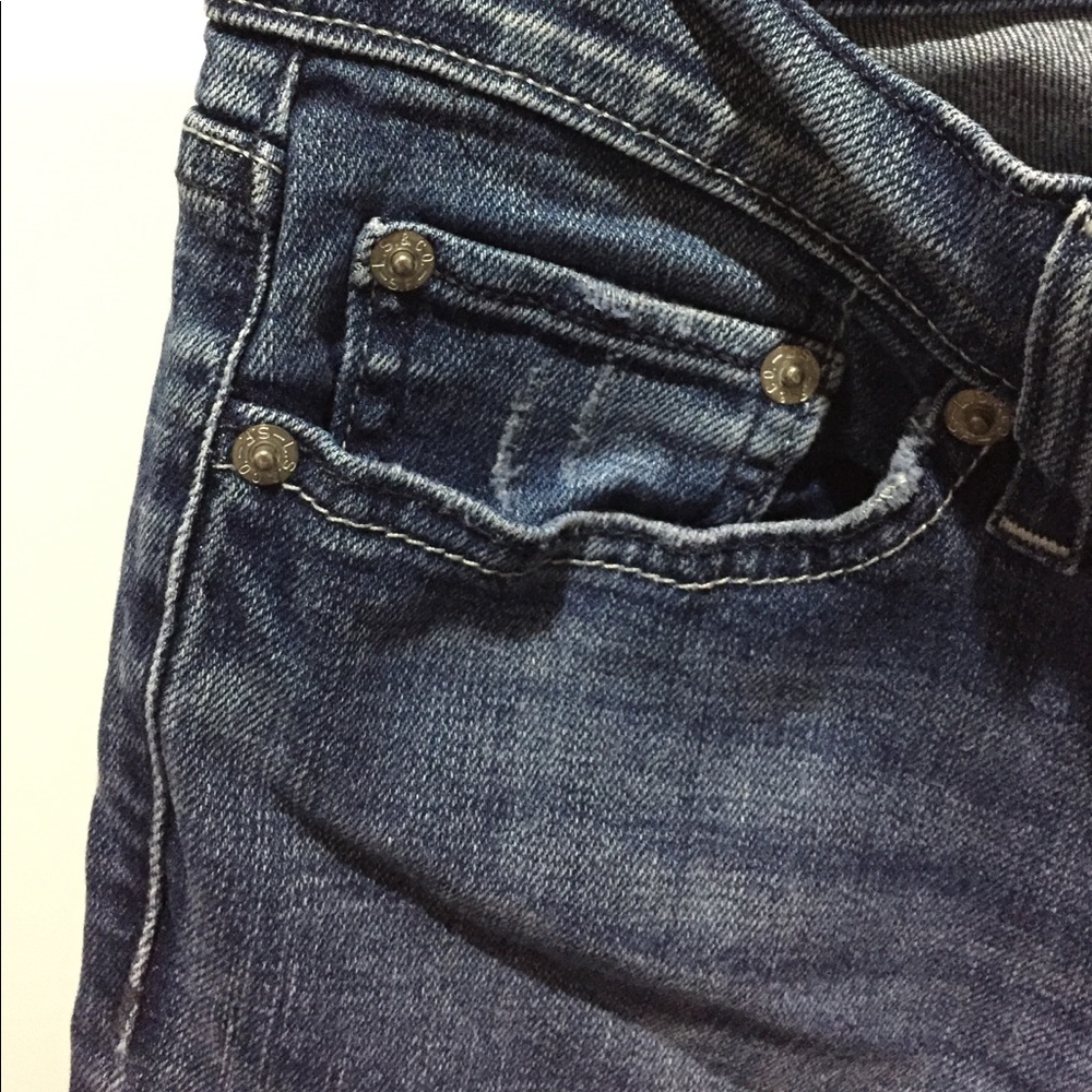 Levi Distressed super low boot cut jeans