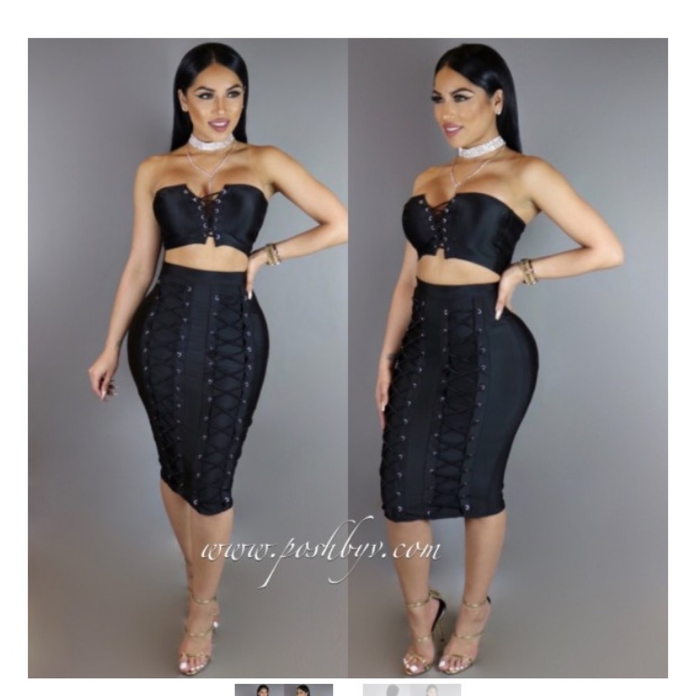Black skirt two piece with ties down the middle.