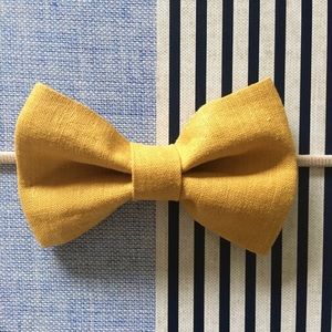 Mustard yellow bow w/ light tan nylon bow