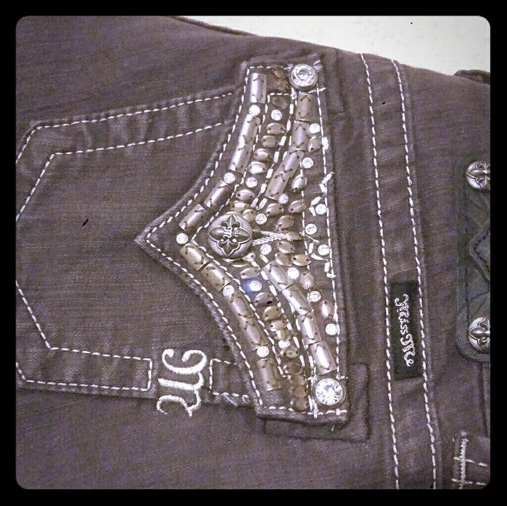 Dark wash Miss Me skinny jeans with embellishments