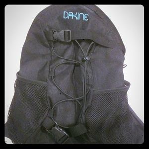 Black and turquoise Dakine Backpack