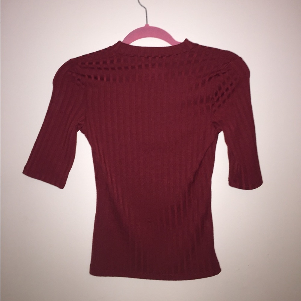 A red top that goes halfway down your arm