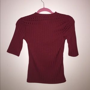 A red top that goes halfway down your arm