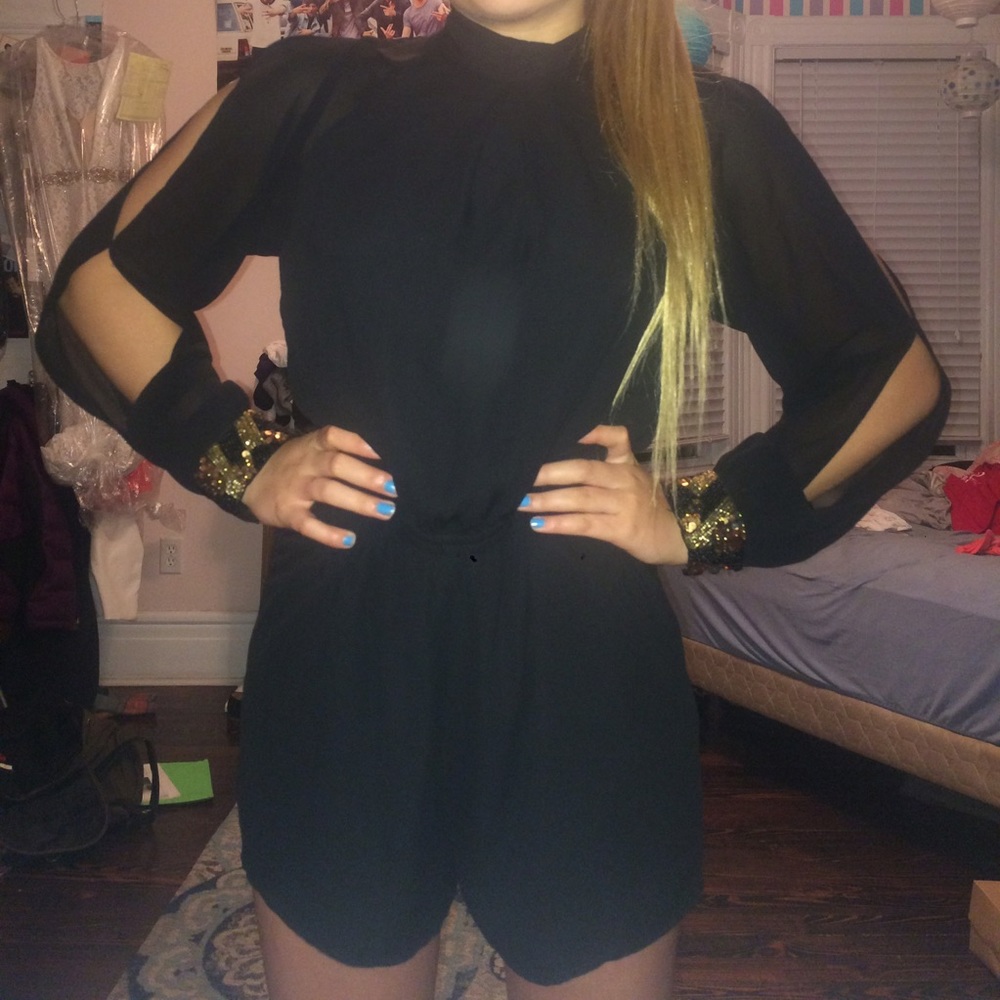 Black open sleeve romper with gold wrists