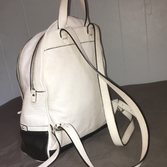 white and black michael kors leather backpack