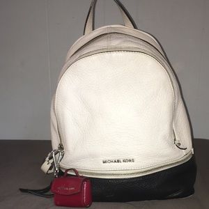 white and black michael kors leather backpack