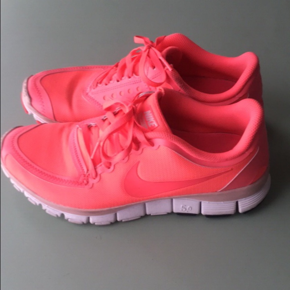 Bright pink Nike running shoes