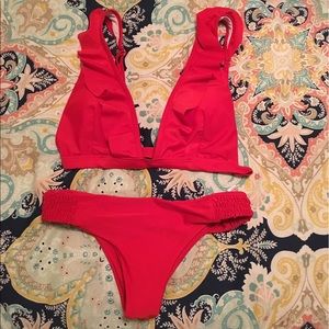 Red cheeky bikini. NEVER worn.