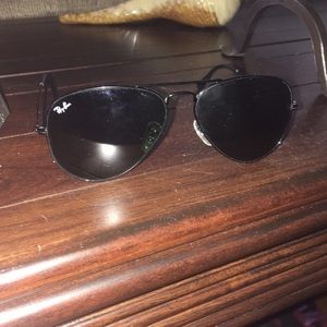 All black Rayban sunnies