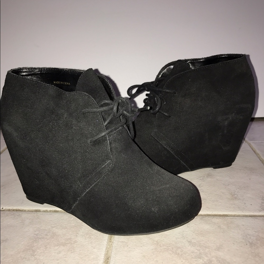 Black suede wedge boots.