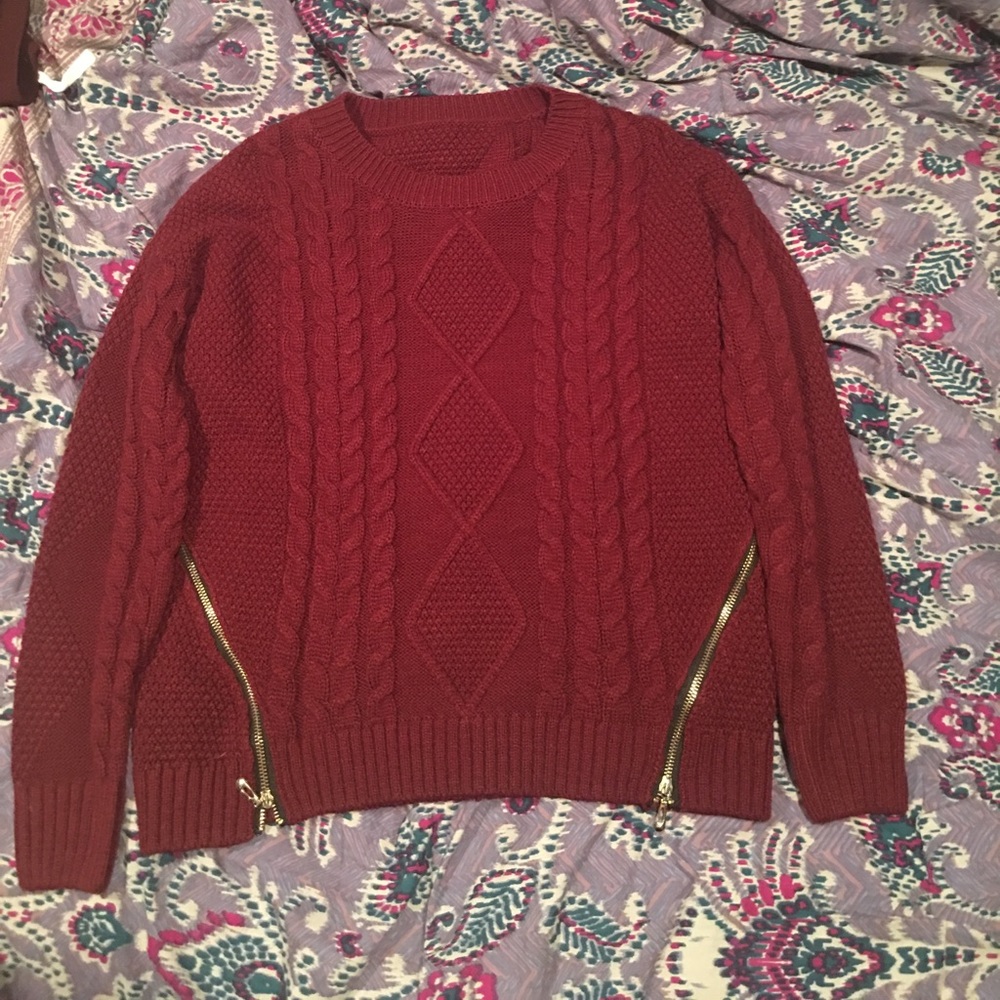 Maroon sweater with gold zipper detailing