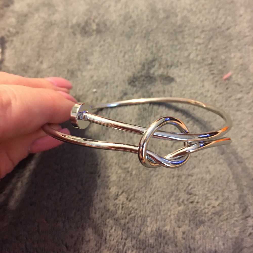 NWT stainless steel love knot bracelets.