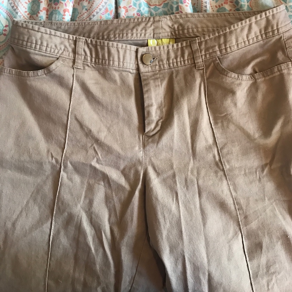 Khakis raised Seam in front. Leg slightly tapered