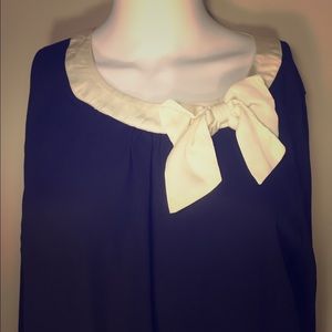 Black and white bow neck top