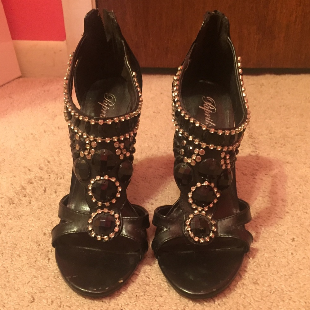 Black jeweled high heels.