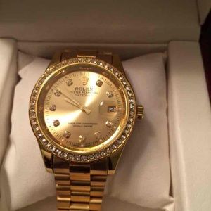 Gold Rolex diamond face