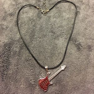 NWOT stainless steel pink guitar necklace