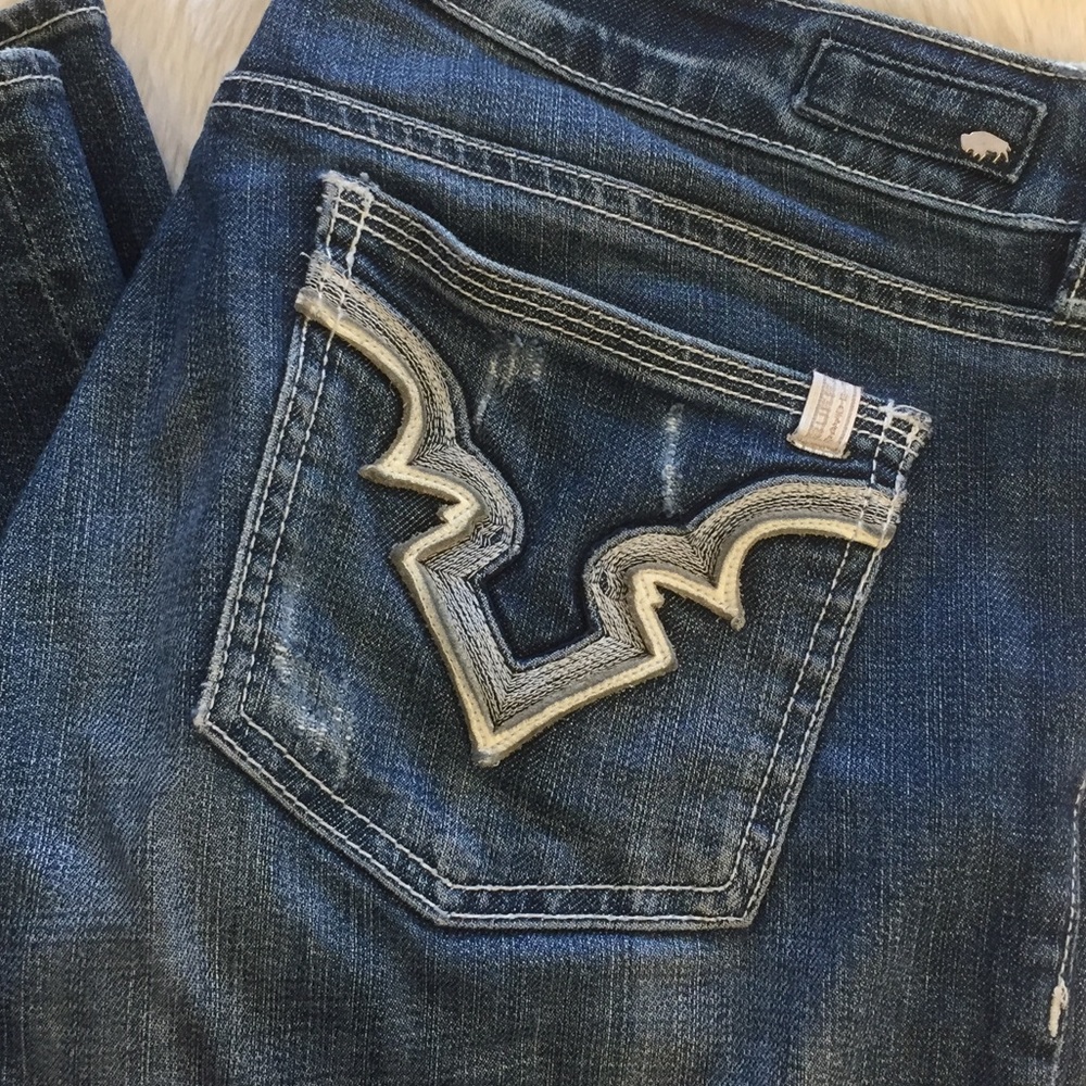 Lightly distressed jeans.