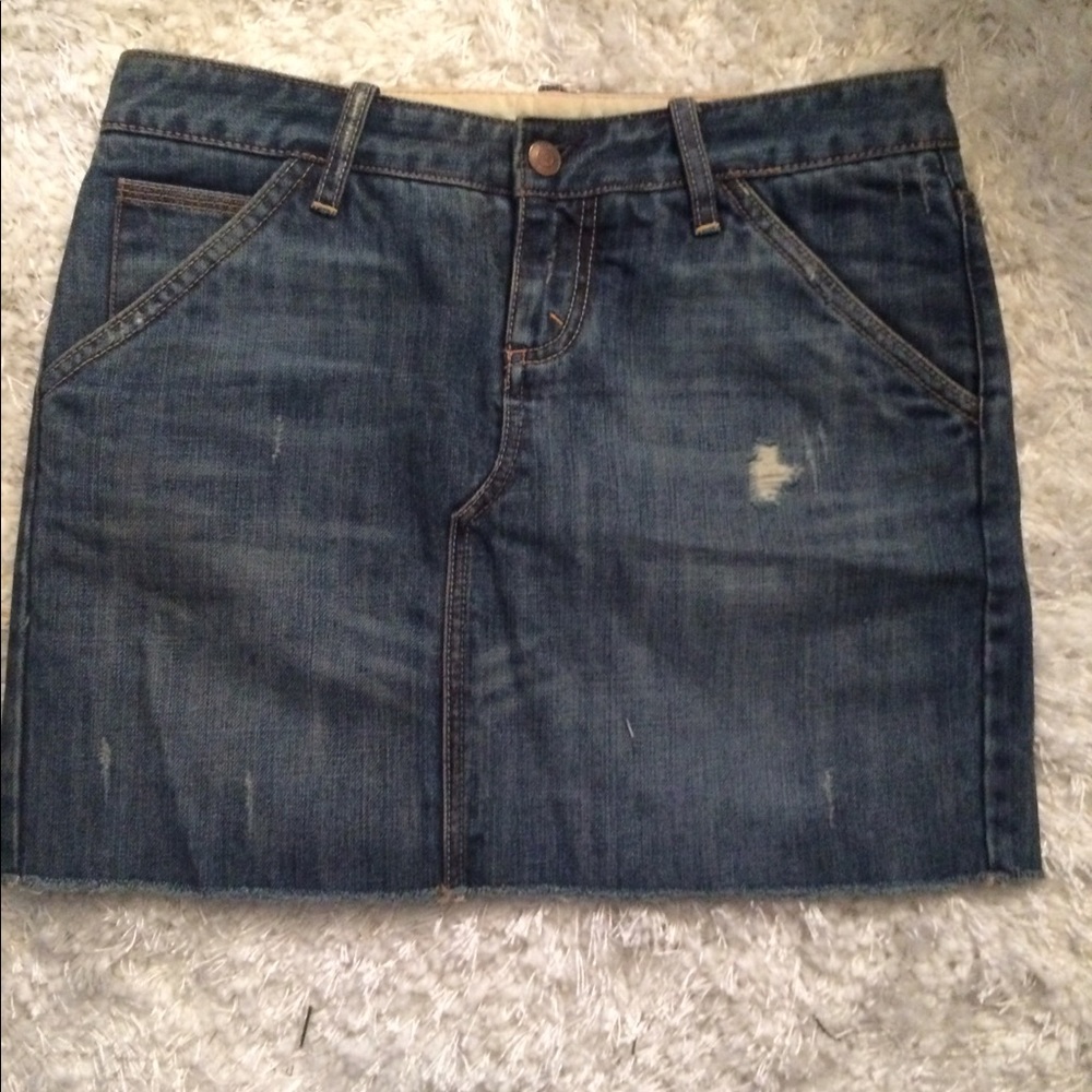 Distressed denim mini skirt