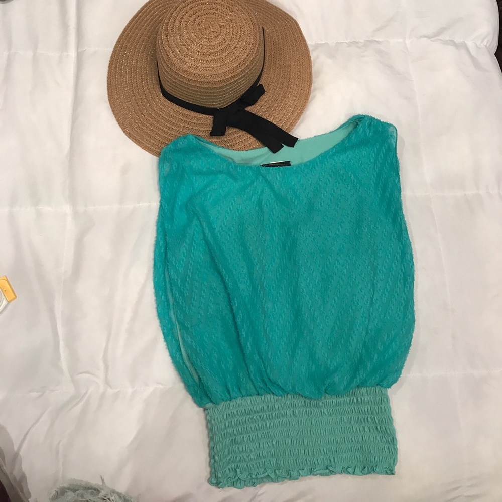 Turquoise blouse.