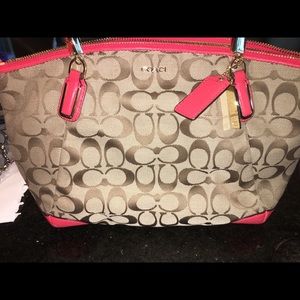Coral and brown coach purse.