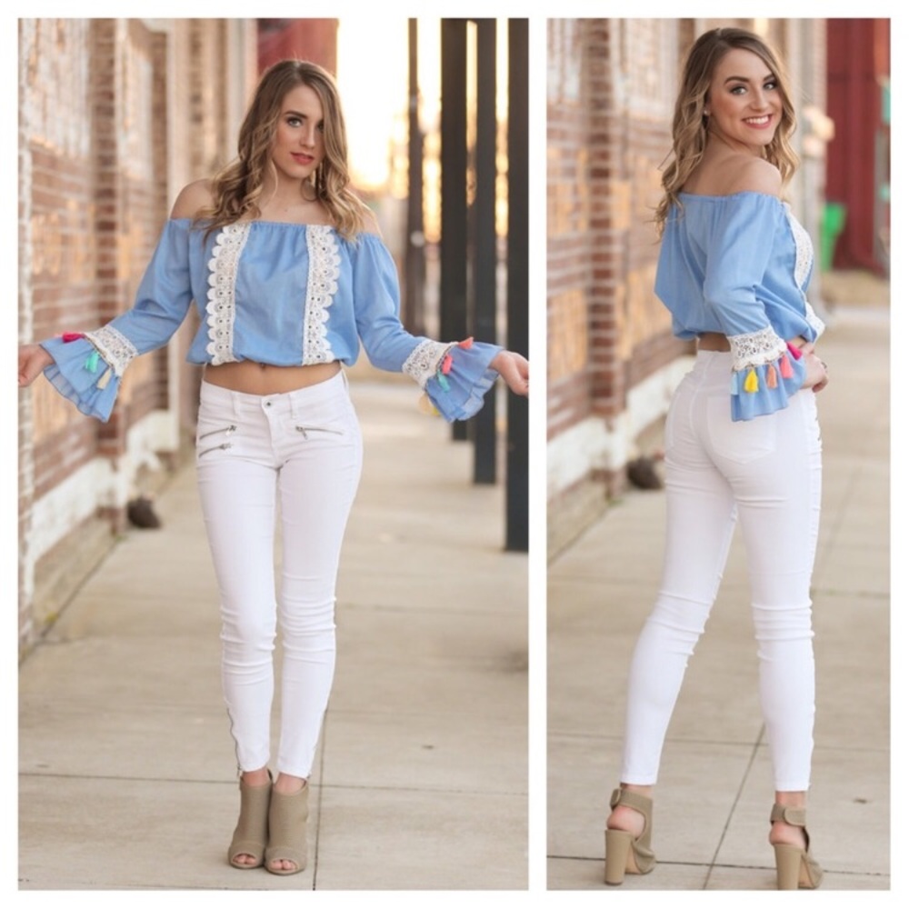 Denim blue crop top with tassel detail on sleeve