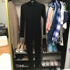 Black jumpsuit with gold zipper