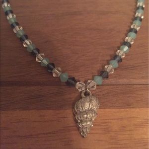 Beaded necklace with shell charm