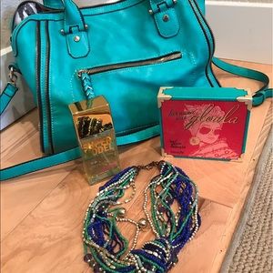 Purse, Benefit Makeup, VS Spray, and jewelry