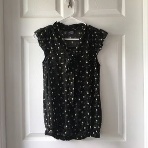 Black floral blouse with flutter sleeves.