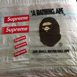 Supreme stickers & bape bag