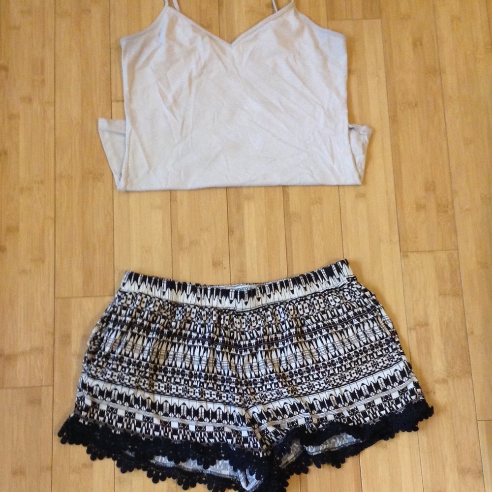 Flowy black/cream shorts with lace detail.
