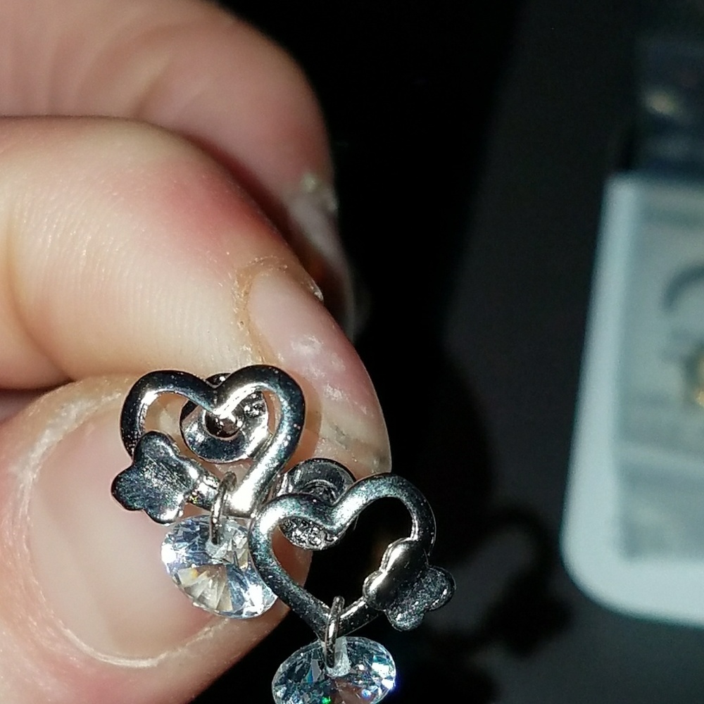 White topaz silver heart studs.