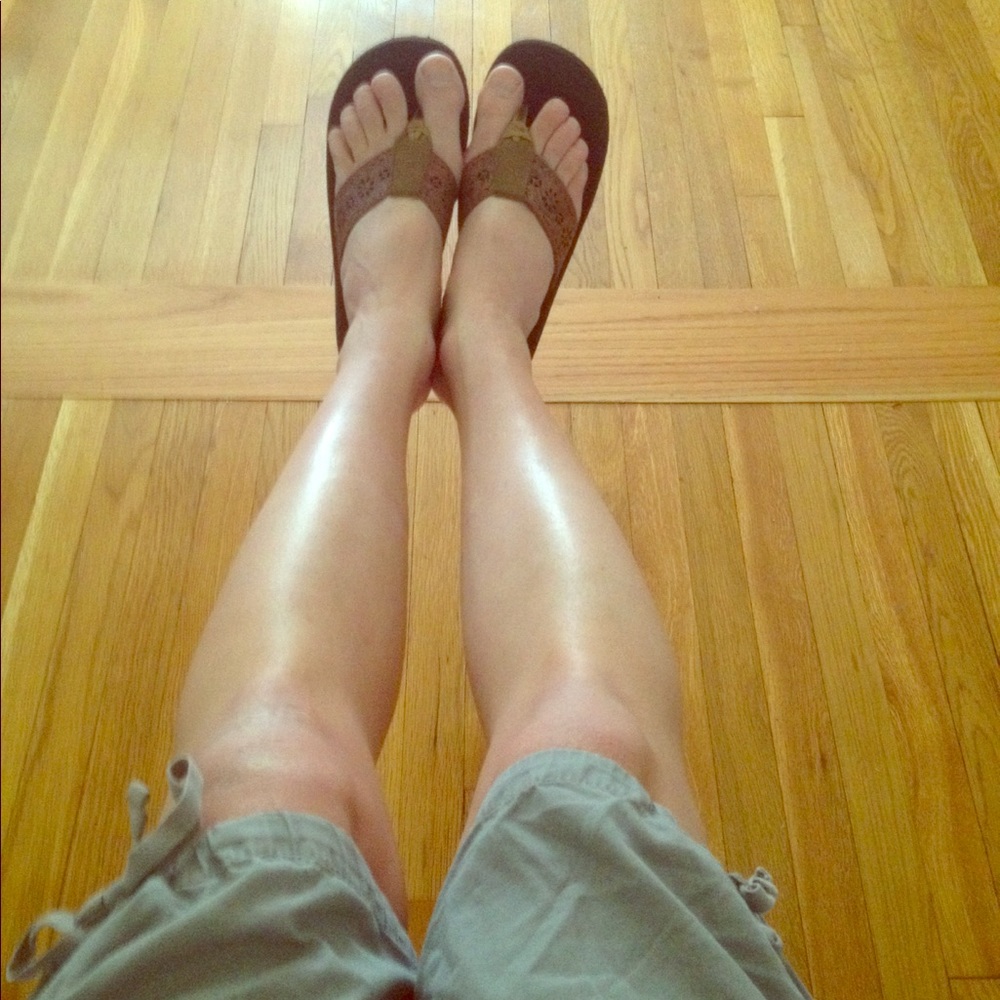 Pre-loved flip flops, worn leather sandals.