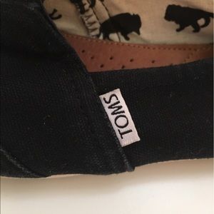 Tons black canvas slip ons!