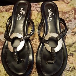 Black sandals with silver circle