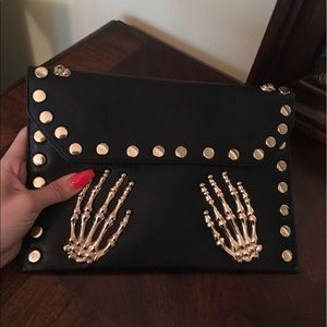 Skeleton hands messenger clutch