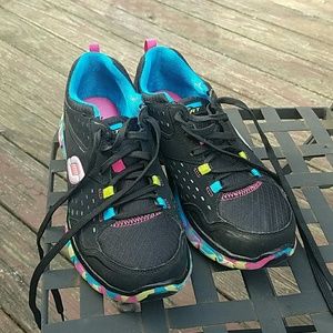 Skechers black with multi color bottoms
