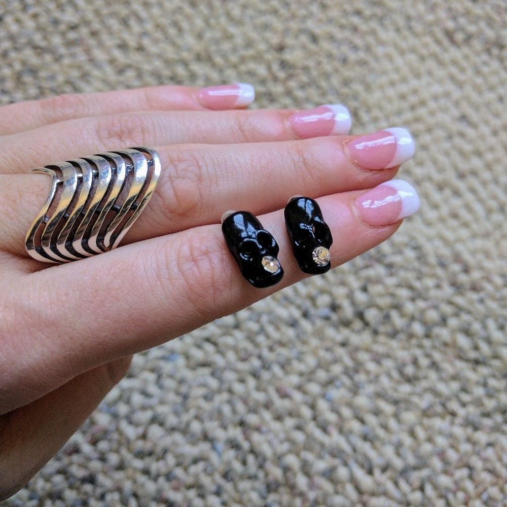 Black metal enamel rhinestone skull earrings