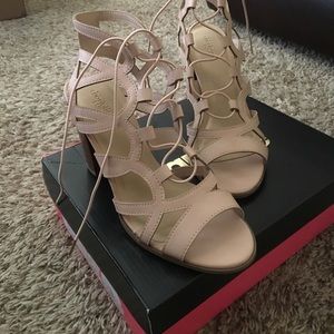 Blush colored heels, slightly worn