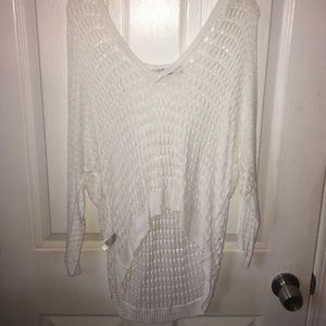 Loose sweater off the shoulder