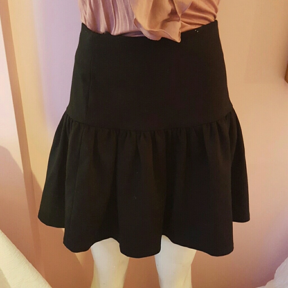 Black skirt with a pleated bottom