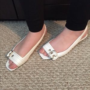 White, sling back, open toe low wedge.