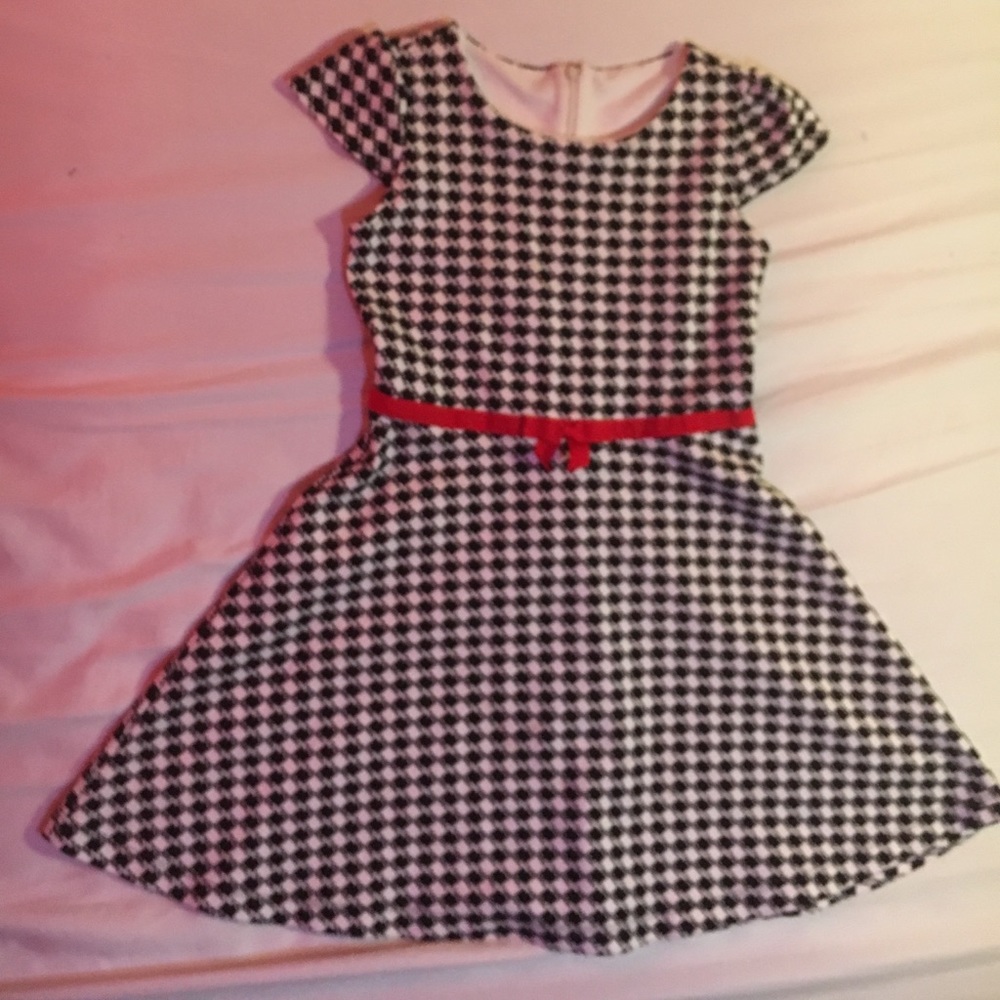 A black and white dress with red lace for girls.