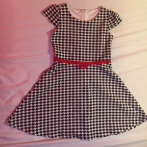 A black and white dress with red lace for girls.